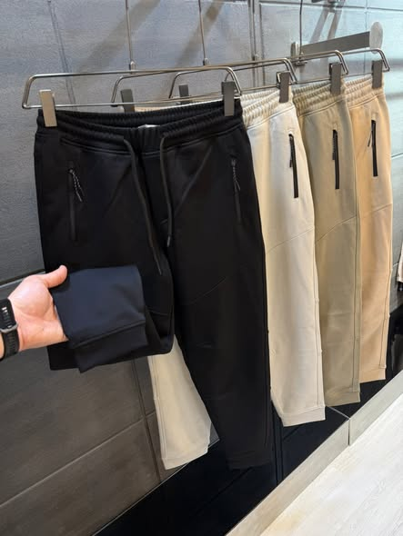 Black and cream Surfer Jeans joggers on display